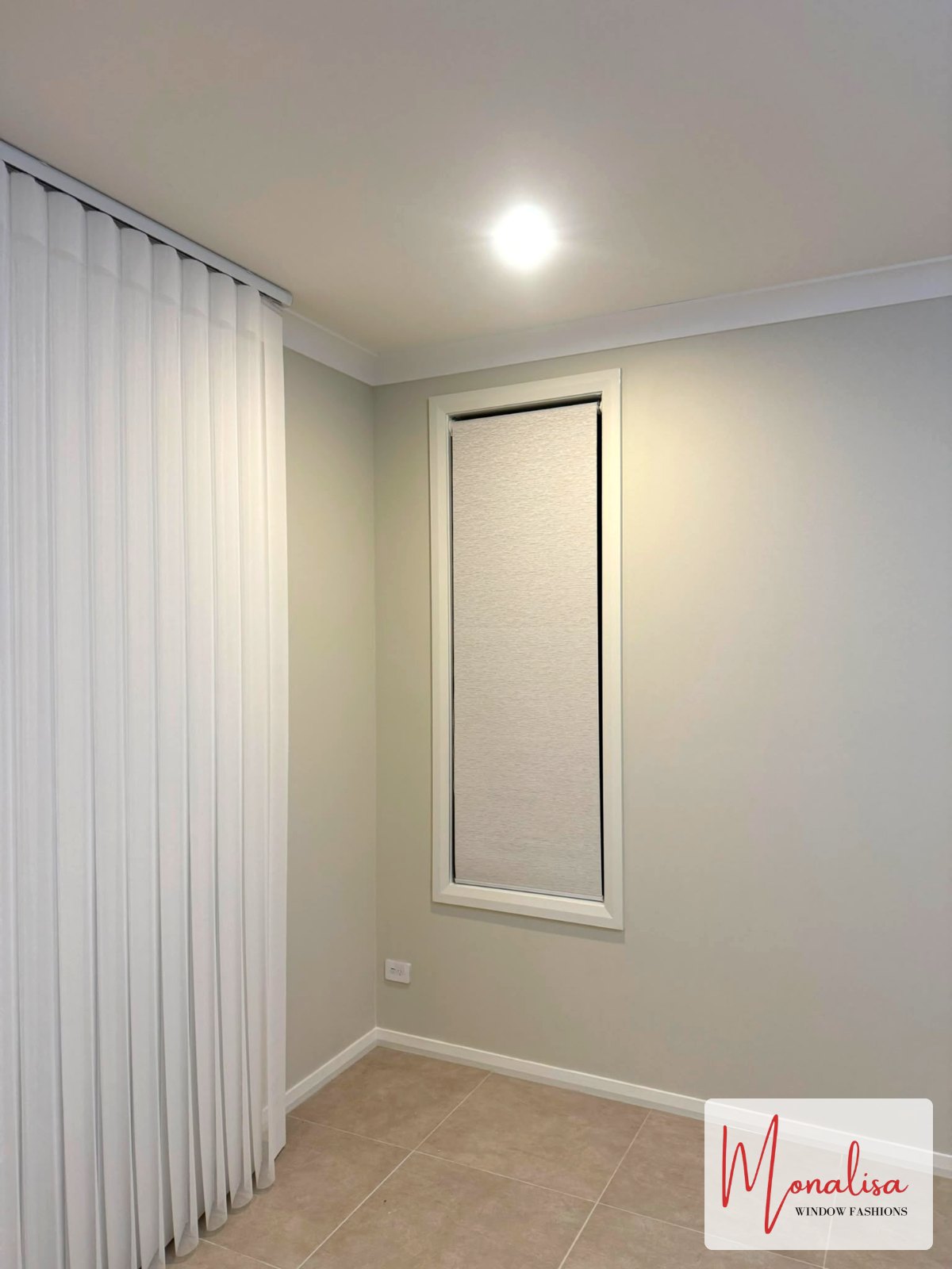 Sheer curtain and blockout roller blind combination in a Gables bedroom