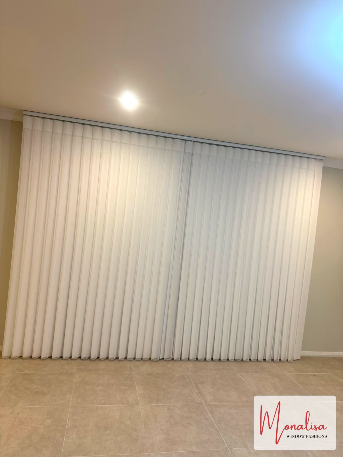 Close-up of ceiling-mounted white S-Fold sheer curtains installed in Gables